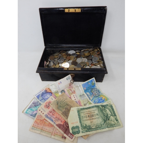 76 - Vintage tin containing a large selection of coins and world banknotes