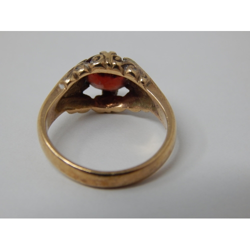 414 - 9ct Yellow Gold Ring Set with a Central Garnet: Gross weight 3.6g: Size I/J