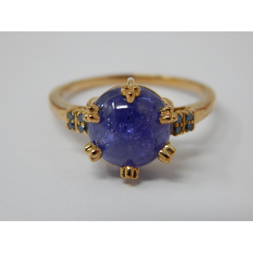 446 - 9ct Yellow Gold Ring Set with a Central Tanzanite Cabochon with Blue Diamond Accents: Total 5.58cts:... 