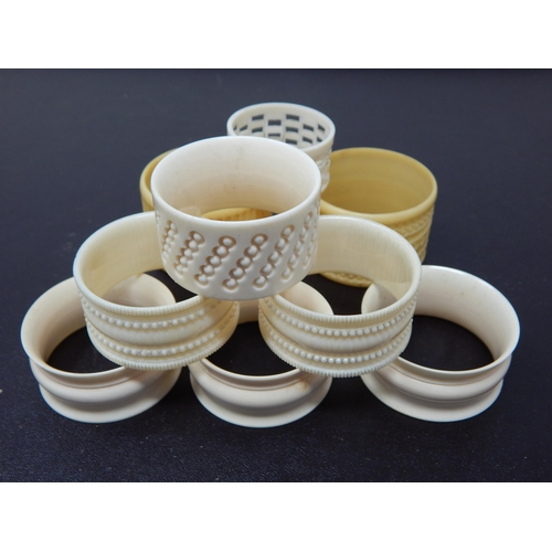 640 - A Collection of 8 Various Ivory & Early Plastic Napkin Rings