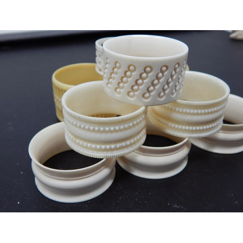 640 - A Collection of 8 Various Ivory & Early Plastic Napkin Rings