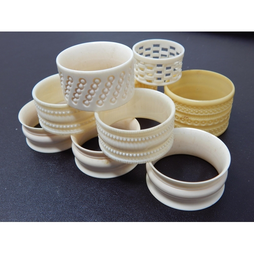 640 - A Collection of 8 Various Ivory & Early Plastic Napkin Rings