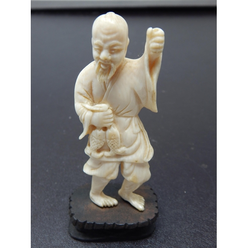 641 - Late C19th/20th Meiji Okimono of a Fisherman on Stand 12cm high