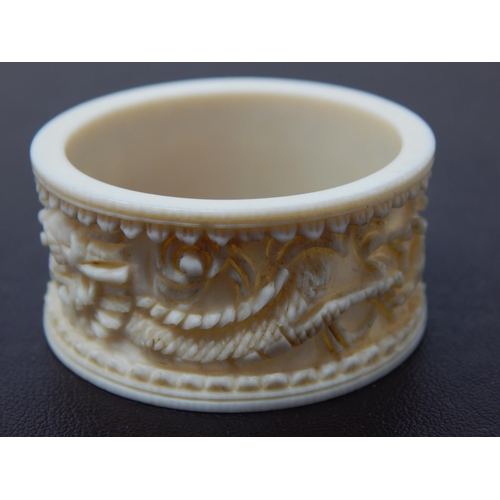 647 - A Deep Carved Late C19th/Early C20th Chinese Ivory Napkin Ring Depicting a Dragon