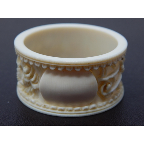 647 - A Deep Carved Late C19th/Early C20th Chinese Ivory Napkin Ring Depicting a Dragon