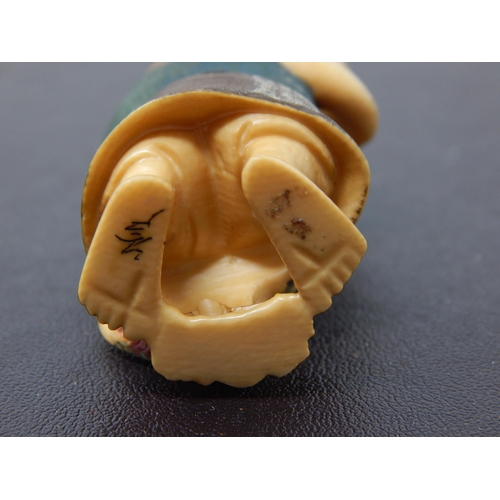 652 - Signed Late C19th/Early C20th Japanese polychrome inked Ivory Netsuke in the form of an Elder with F... 