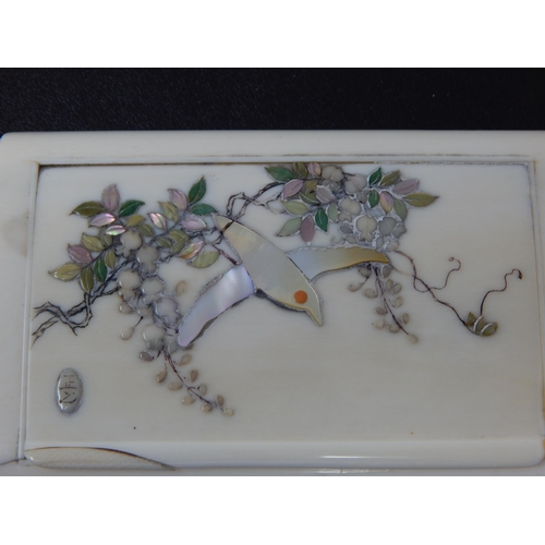 655 - Japanese Hinge Lidded Ivory Box with Shibayama Decoration of a Bird in Flight. Measures 10cm x 7cm x... 