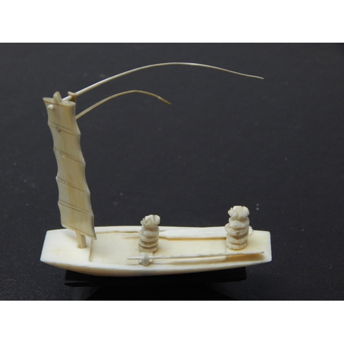 664 - Late C19th/Early C20th Cantonese Carved Ivory miniature of a sailing boat with two crew and two oars... 