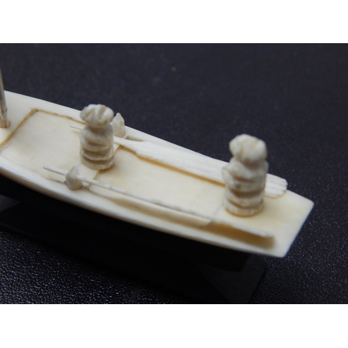 664 - Late C19th/Early C20th Cantonese Carved Ivory miniature of a sailing boat with two crew and two oars... 