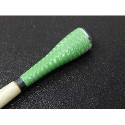 673 - An Art Deco White Metal & Green Guilloche Enamel Cigarette Holder: Measuring 7cm