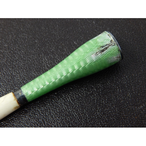 673 - An Art Deco White Metal & Green Guilloche Enamel Cigarette Holder: Measuring 7cm