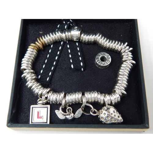 361 - Links of London Silver Charm Bracelet with attached silver charms. The bracelet also has five yellow... 