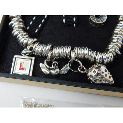 361 - Links of London Silver Charm Bracelet with attached silver charms. The bracelet also has five yellow... 