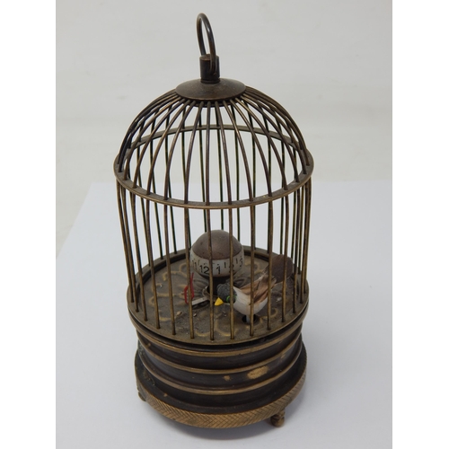 601 - Automaton Bird in Brass Cage Bottom Wind Clock: Measuring 15cm high. Working When Catalogued