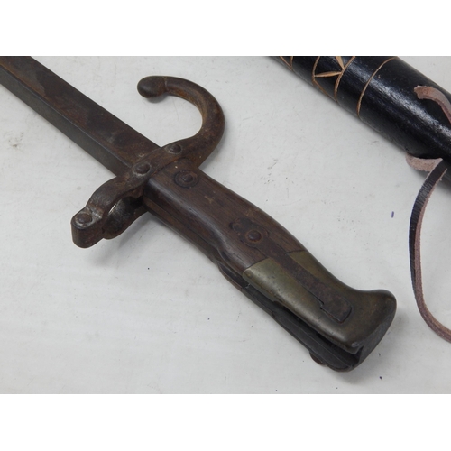 571 - WWI French bayonet 64cm together with an African Wooden handled Axe 56.5cm