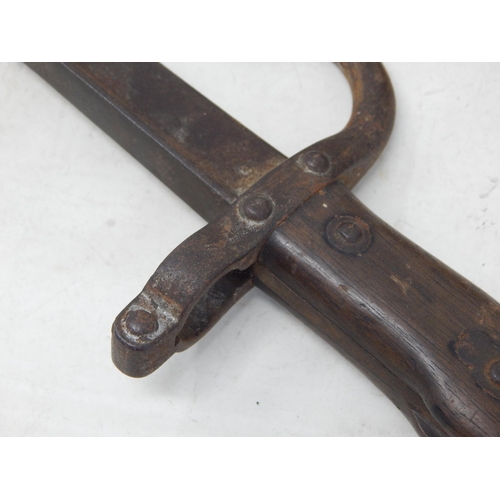 571 - WWI French bayonet 64cm together with an African Wooden handled Axe 56.5cm