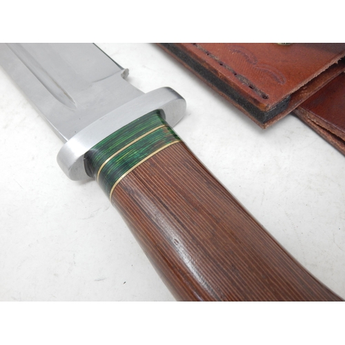 515 - Bowie Knife with Wooden Grip in Leather Scabbard Measuring 33.5cm