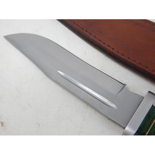 515 - Bowie Knife with Wooden Grip in Leather Scabbard Measuring 33.5cm