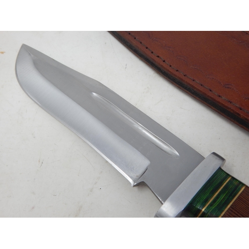 515 - Bowie Knife with Wooden Grip in Leather Scabbard Measuring 33.5cm