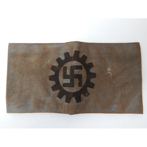 530 - WWII Nazi Germany Armband with Swastika within a Cogwheel.