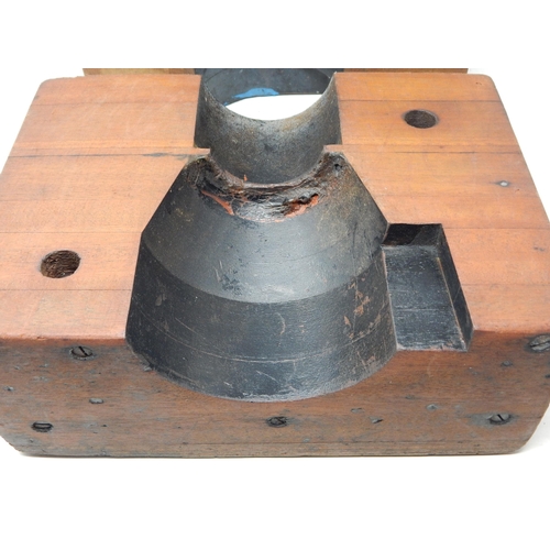 554 - A pair of Wooden Tank Shell Moulds together with a copy of 