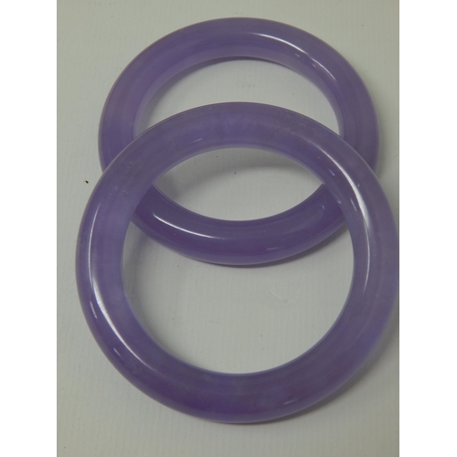 392 - Two Chinese Lilac Jade Bangles (2)