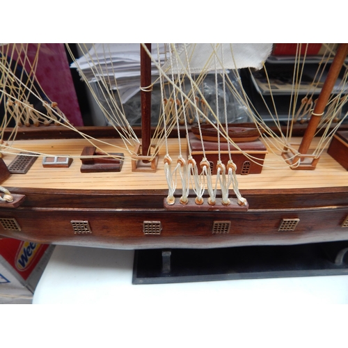 599 - Wooden Model of a Three Masted Galleon: Reputably from Admiralty House. Measuring 95cm wide x 66cm h... 