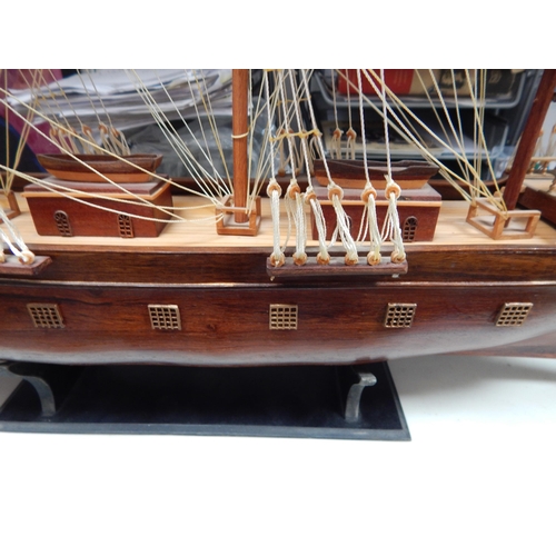 599 - Wooden Model of a Three Masted Galleon: Reputably from Admiralty House. Measuring 95cm wide x 66cm h... 