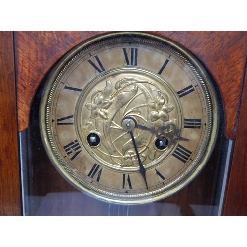 611 - Dutch Art Nouveau Wooden Cased Wall Clock. The Brass Dial Centred with Sinuous Flowers & The Pendulu... 