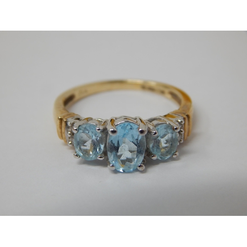 333 - 9ct Yellow Gold Ring Set with Three Aquamarines Flanked either side by Two Diamonds: Size M 1/2