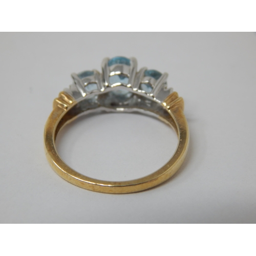 333 - 9ct Yellow Gold Ring Set with Three Aquamarines Flanked either side by Two Diamonds: Size M 1/2