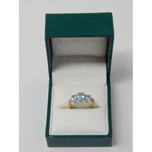 333 - 9ct Yellow Gold Ring Set with Three Aquamarines Flanked either side by Two Diamonds: Size M 1/2