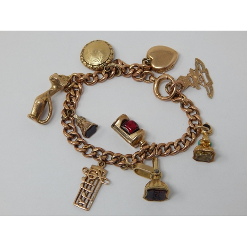 340 - 9ct Yellow Gold Charm Bracelet with attached charms: Gross weight 36.8g