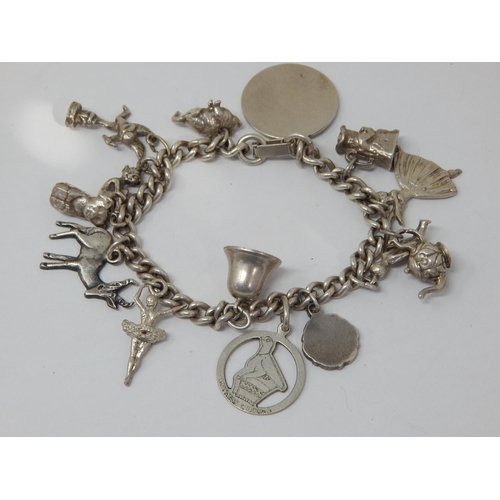 363 - Silver Charm Bracelet with numerous Charms: Weight 60g