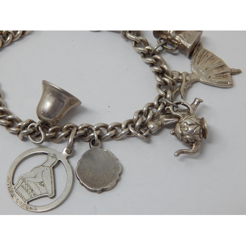 363 - Silver Charm Bracelet with numerous Charms: Weight 60g