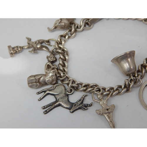 363 - Silver Charm Bracelet with numerous Charms: Weight 60g