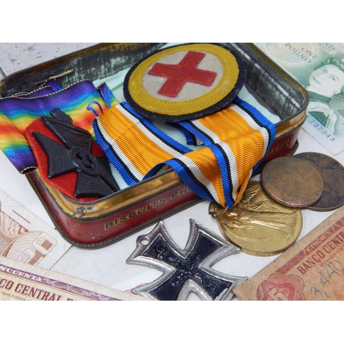 65 - Vintage Tin containing a collection of War Medals and a collection of banknotes