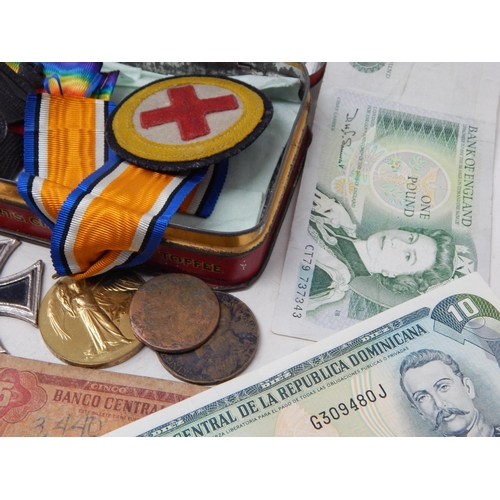 65 - Vintage Tin containing a collection of War Medals and a collection of banknotes