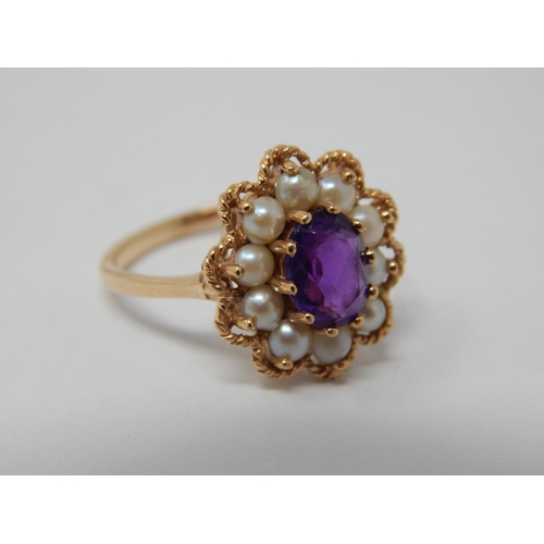 118 - Vintage 9ct Yellow gold ring set with a central amethyst within a pearl border by A & Co: Size M: we... 