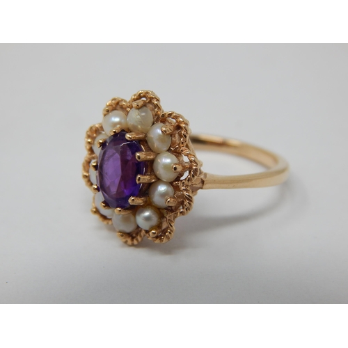 118 - Vintage 9ct Yellow gold ring set with a central amethyst within a pearl border by A & Co: Size M: we... 