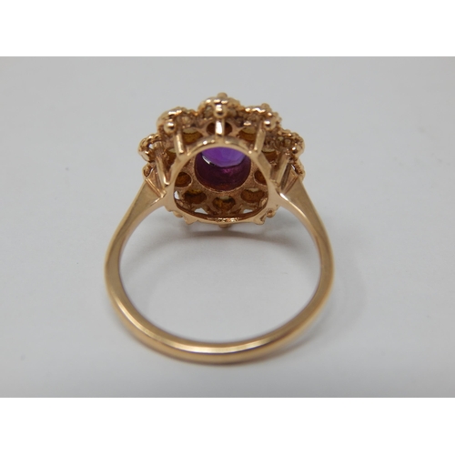 118 - Vintage 9ct Yellow gold ring set with a central amethyst within a pearl border by A & Co: Size M: we... 