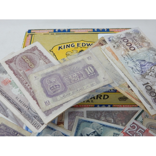 89 - A large collection of GB and World banknotes housed in a vintage cigar box