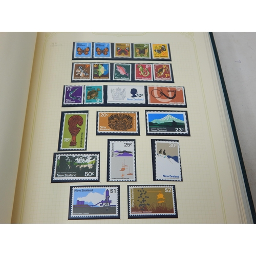 102 - A huge collection of Mint Stamps housed in 2 x vintage green Stanley Gibbons albums comprising: Asce... 