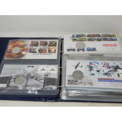 64 - Collection of Royal Mail/Royal Mint Philatelic Numismatic Covers housed in a blue collectors album