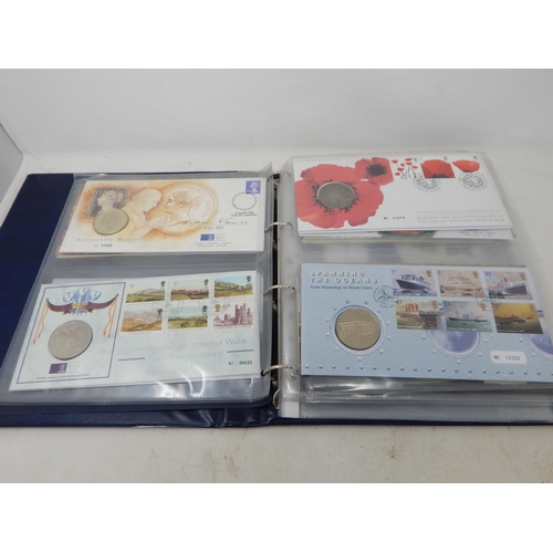 64 - Collection of Royal Mail/Royal Mint Philatelic Numismatic Covers housed in a blue collectors album