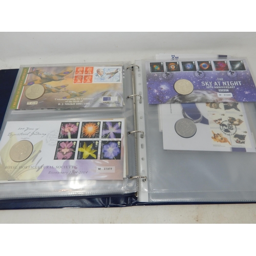 64 - Collection of Royal Mail/Royal Mint Philatelic Numismatic Covers housed in a blue collectors album