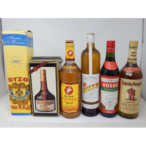 954 - 6 Bottles of Oyzo, Commadaria, Ron Anejo Pampero, Suze, Vermouth & Captain Morgans Rum.