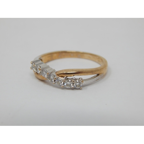 257 - 9ct Yellow Gold Diamond Crossover Ring Set with Seven Diamonds: Ring Size K: Gross weight 1.7g