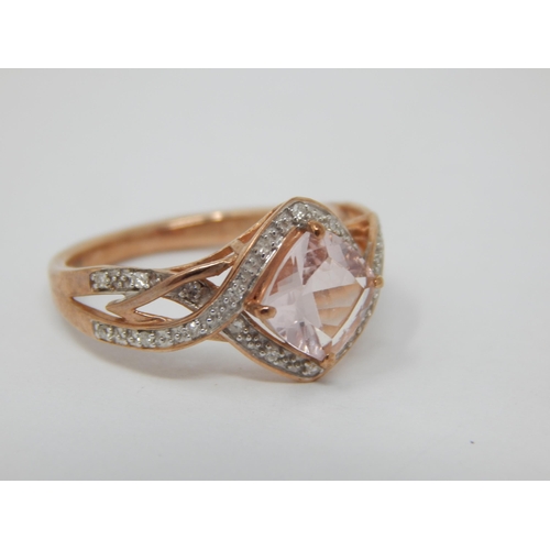 263 - 9ct Rose Gold Ring Set with a Central Pink Topaz within a Diamond Border: Ring Size M: Gross weight ... 