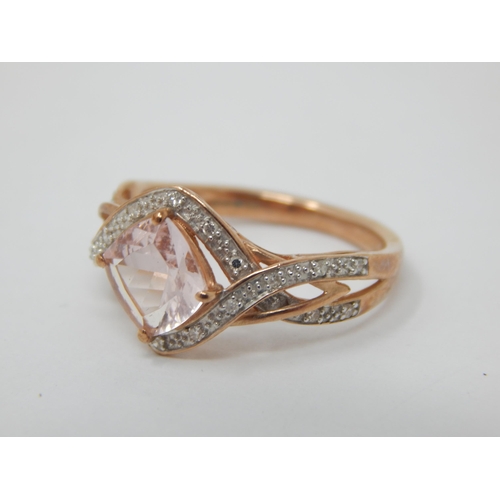 263 - 9ct Rose Gold Ring Set with a Central Pink Topaz within a Diamond Border: Ring Size M: Gross weight ... 